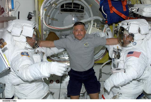 NASA image: Sellers and Wolf attired in their EMU's during Expedition Five on the ISS