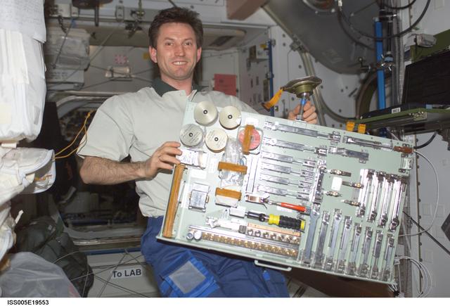 NASA image: Treschev holds a pallet of tools in the Node 1 during Expedition Five on the ISS