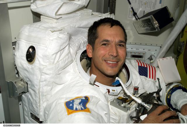 NASA image: STS-113 Mission Specialist Herrington wearing an EMU Spacesuit while in the Quest Airlock