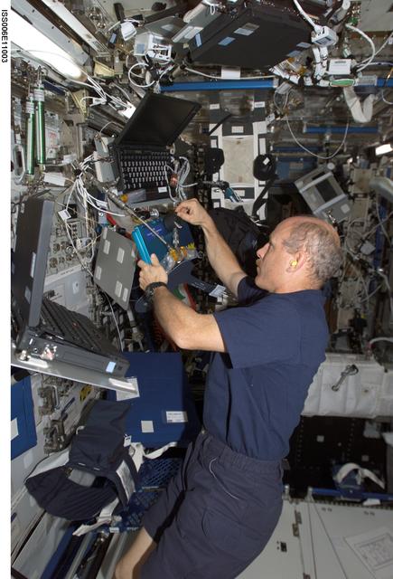 NASA image: Bowersox works with the Flight Calibration Unit in the U.S. Laboratory during Expedition Six