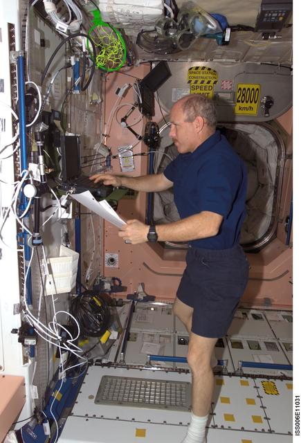 NASA image: Bowersox works on a laptop computer in Node 1 during Expedition Six