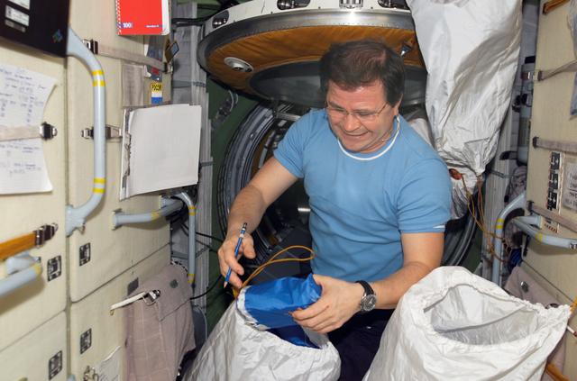 NASA image: Budarin takes inventory of medical equipment on the FGB during Expedition Six