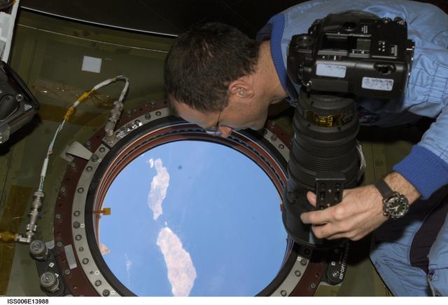 NASA image: Pettit takes pictures of Earth from the window in Destiny during Expedition Six