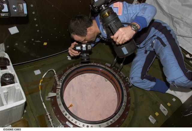 NASA image: Pettit takes pictures of Earth from the window in Destiny during Expedition Six