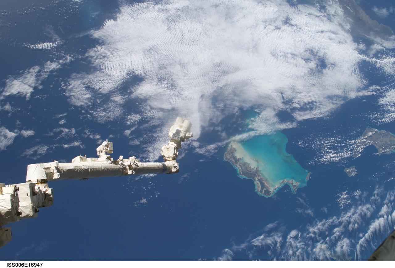 ISS006-E-16947 (9 January 2003) --- The Space Station Remote Manipulator System (SSRMS) or Canadarm2 is pictured over the Bahama Islands in this digital still camera's view taken from the International Space Station (ISS).