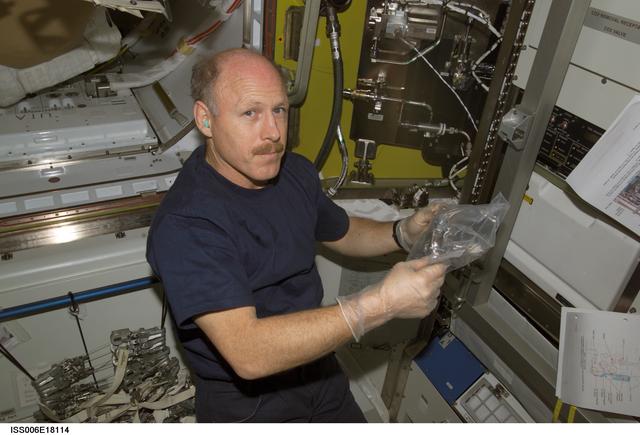 NASA image: Bowersox handles part of the 02 / N2 system in the Airlock during Expedition Six