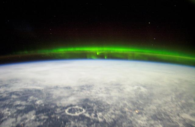 NASA image: Crew Earth Observations (CEO) of the Aurora Borealis and city lights taken during Expedition Six