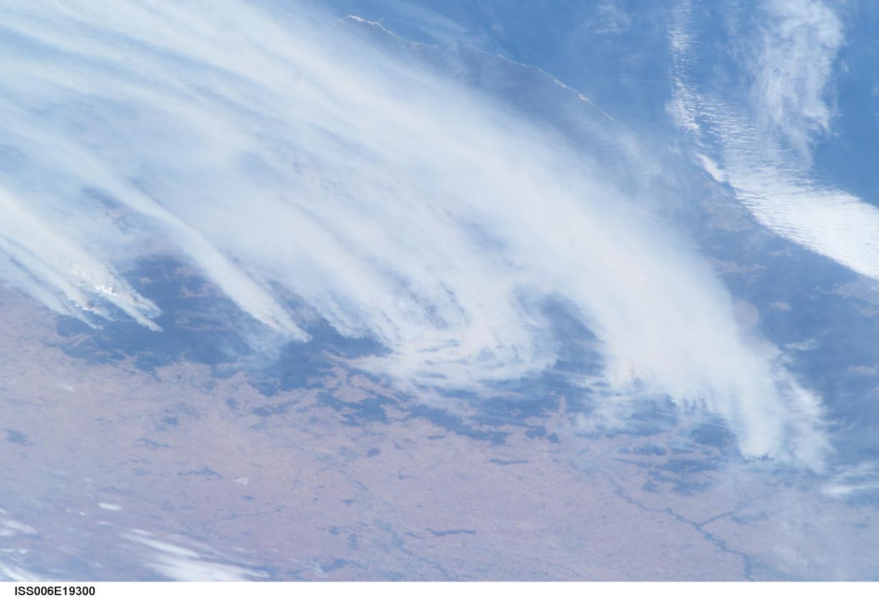 ISS006-E-19300 (18 January 2003) --- Bushfires in southeastern Australia were captured with a digital still camera by one of the Expedition Six crewmembers on the International Space Station (ISS). Brisk winds were sweeping smoke plumes eastward off the Australian coast north of Cape Howe. The agricultural valleys of the Murrumbidgee and Murray Rivers give way to the burning, darker bush areas of the mountains with the extreme eastern coastline of Victoria visible beyond.
