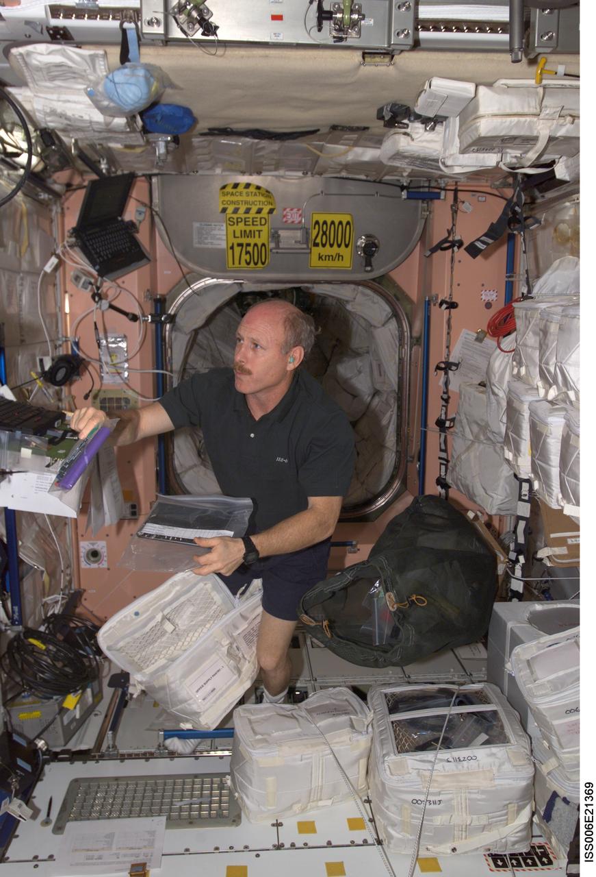 ISS006-E-21369 (31 January 2003) --- Astronaut Kenneth D. Bowersox, Expedition Six mission commander, moves toward a computer in the Unity node on the International Space Station (ISS).