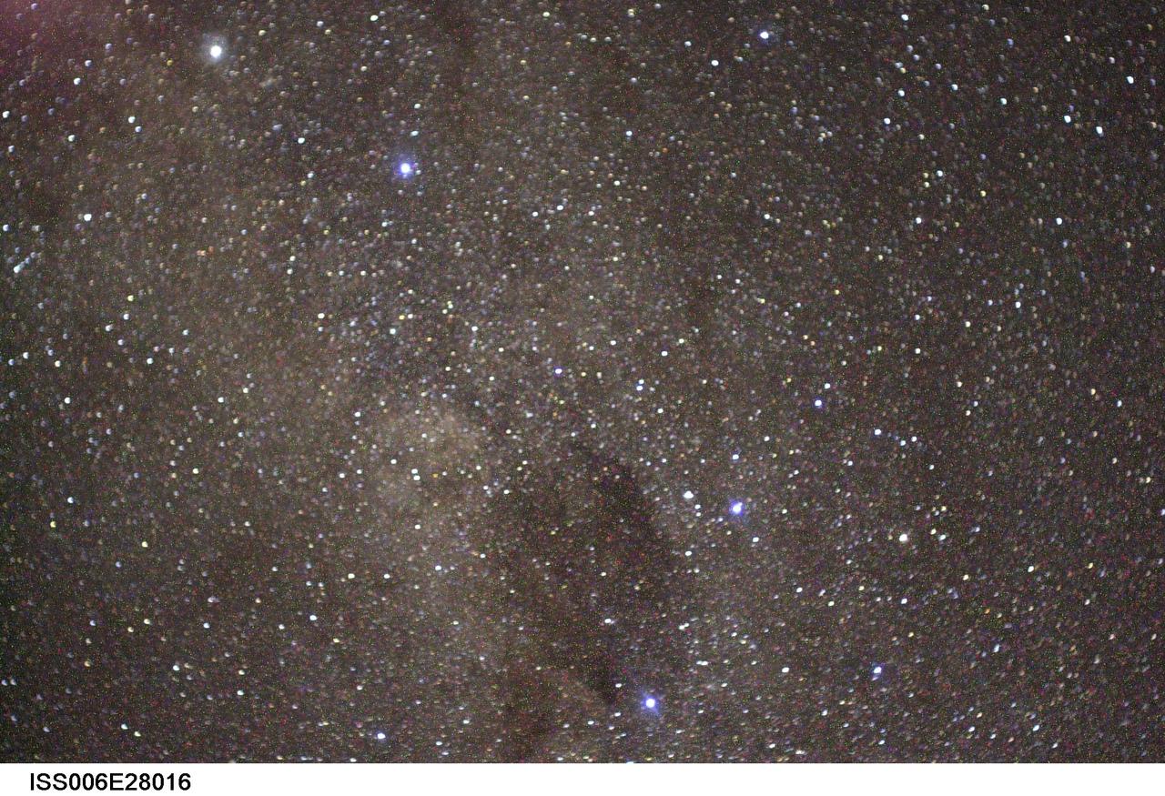 ISS006-E-28016 (February 2003) --- The Coal Sack Nebula (bottom center), the Southern Cross (lower right), and the two prominent stars in the upper left, which are the two prominent stars of the southern constellation Centaurus, are visible in this view photographed by astronaut Donald R. Pettit, Expedition Six NASA ISS science officer, on board the International Space Station (ISS).