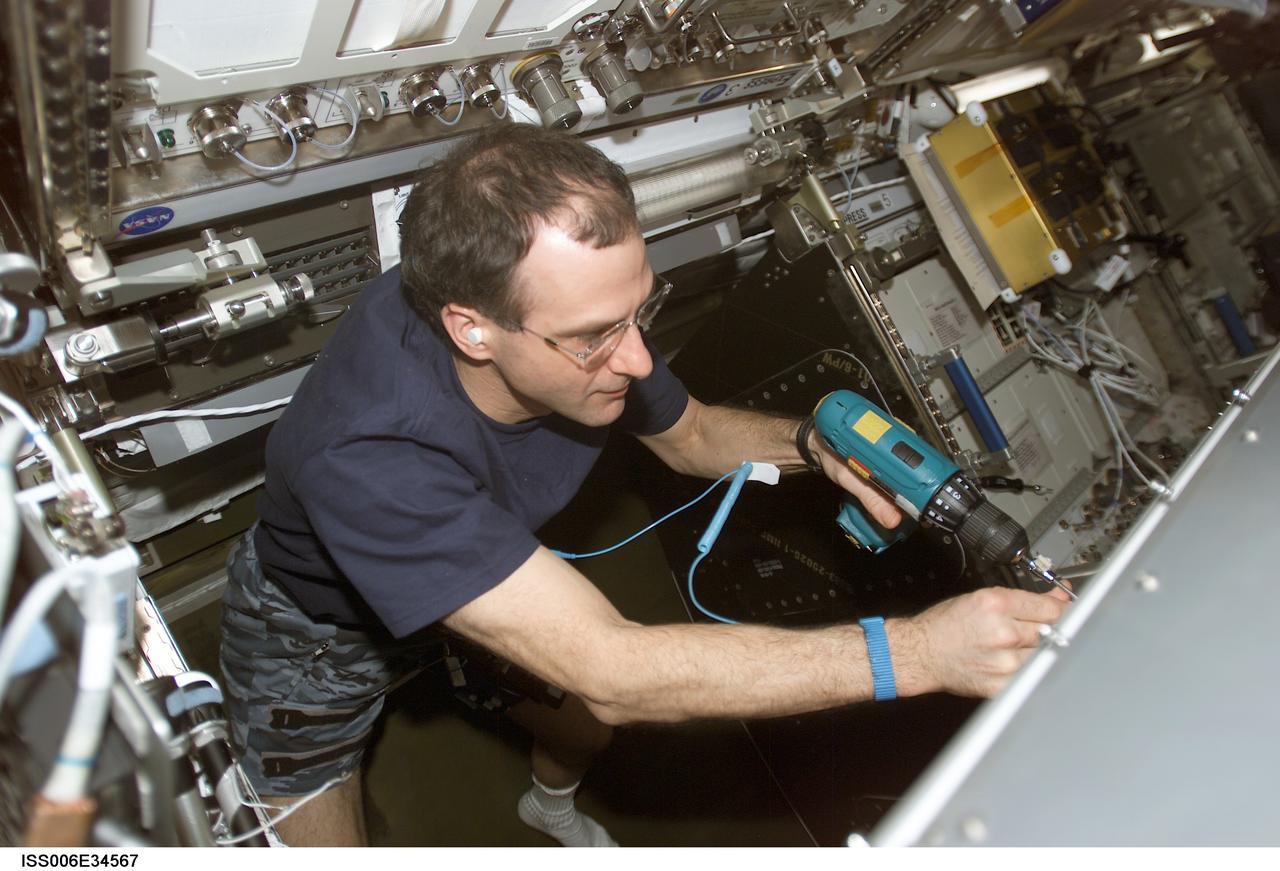 ISS006-E-34567 (27 February 2003) --- Astronaut Donald R. Pettit, Expedition Six NASA ISS science officer, works on the Microgravity Science Glovebox (MSG) in the Destiny laboratory on the International Space Station (ISS).