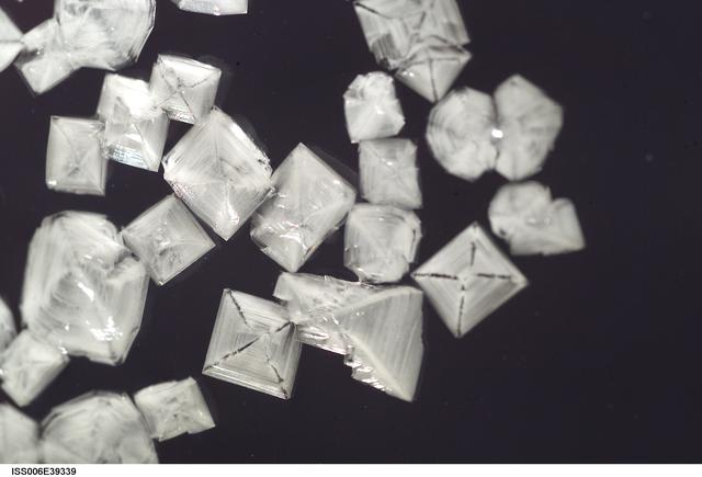 NASA image: View of salt crystals inserted within a 50mm metal loop in the U.S. Laboratory