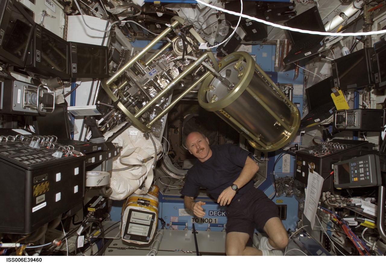 ISS006-E-39460 (18 March 2003) --- Astronaut Kenneth D. Bowersox, Expedition Six mission commander, is pictured in the Destiny laboratory on the International Space Station (ISS). The supply tank and Fluid Control Pump Assembly (FCPA), which are a part of the Internal Thermal Control System (ITCS), are visible floating freeing above Bowersox.