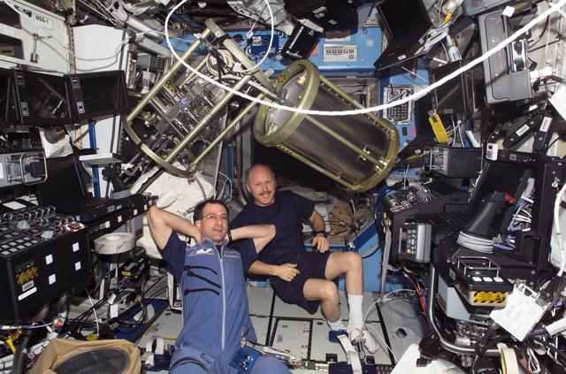 NASA image: Commander Kenneth D. Bowersox and Flight Engineer Donald R. Pettit are relaxing in the U.S. Lab