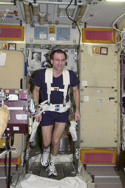 ISS006-E-45265 (20 March 2003) --- Astronaut Donald R. Pettit, Expedition 6 NASA ISS science officer, exercises on the Treadmill Vibration Isolation System (TVIS) in the Zvezda Service Module on the International Space Station (ISS).