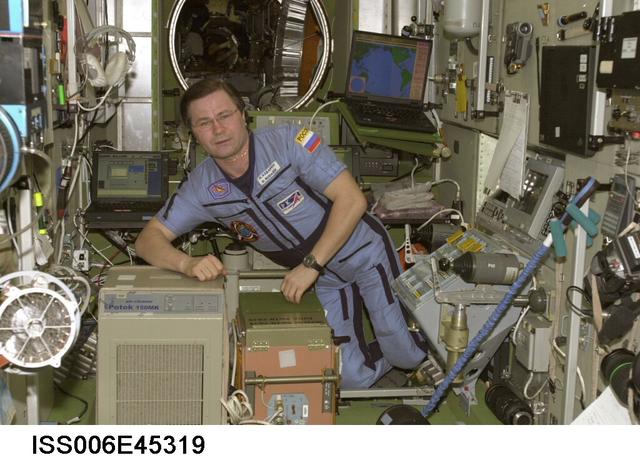 ISS006-E-45319 (1 April 2003) --- Cosmonaut Nikolai M. Budarin, Expedition Six flight engineer, is pictured near the Potok 150MK air decontamination equipment in the Zvezda Service Module on the International Space Station (ISS). Budarin represents Rosaviakosmos.