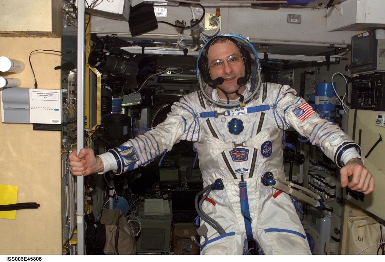 ISS006-E-45806 (14 April 2003) --- Attired in his Russian Sokol suit, astronaut Donald R. Pettit, Expedition Six NASA ISS science officer, is pictured in the Zvezda Service Module on the International Space Station (ISS). The crewmembers are preparing for their return flight home scheduled for May 3, 2003, onboard the Soyuz TMA-1 spacecraft.