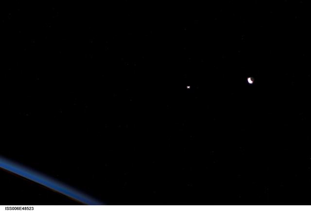 NASA image: View of crescent moon and the planet Venus during Expedition Six