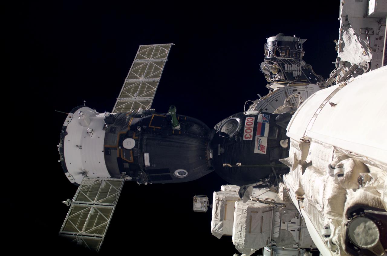 ISS006-E-48631 (28 April 2003) --- The Soyuz TMA-2 spacecraft, which carried the Expedition 7 crew, is docked to the functional cargo block (FGB) nadir port on the International Space Station (ISS).