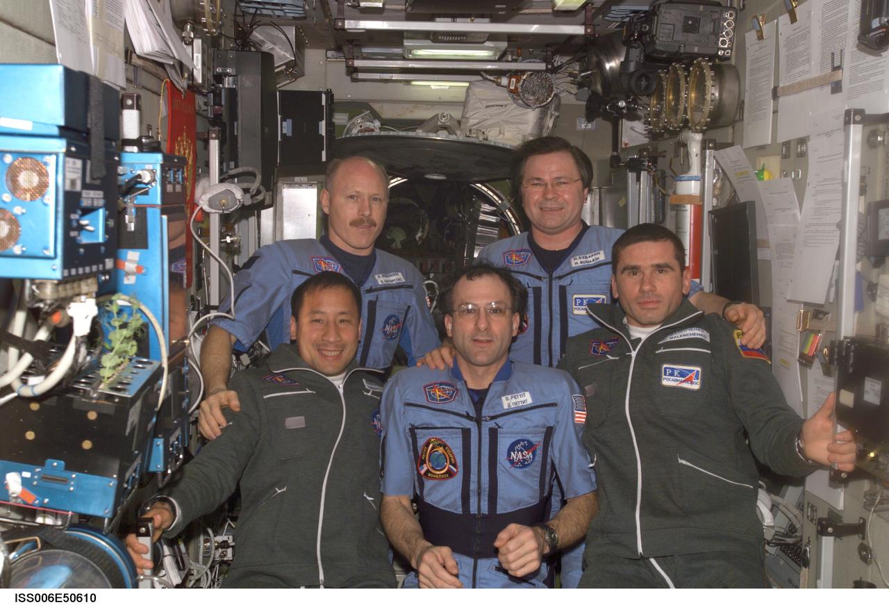 ISS006-E-50610 (28 April 2003) --- The Expedition Six and Seven crews pose for a group photo in the Zvezda Service Module on the International Space Station (ISS). From the left (front row) are astronauts Edward T. Lu, Expedition Seven NASA ISS science officer and flight engineer; Donald R. Pettit, Expedition Six NASA ISS science officer; and cosmonaut Yuri I. Malenchenko, Expedition Seven mission commander. From the left (back row) are astronaut Kenneth D. Bowersox, Expedition Six mission commander, and cosmonaut Nikolai M. Budarin, Expedition Six flight engineer. Budarin and Malenchenko represent Rosaviakosmos.