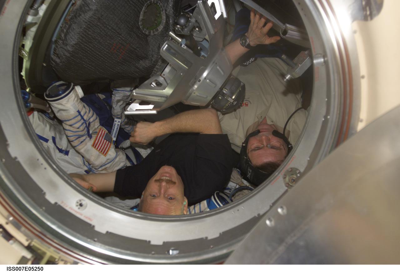 ISS007-E-05250 (3 May 2003) --- Astronaut Kenneth D. Bowersox (left), Expedition Six mission commander, and cosmonaut Nikolai M. Budarin, flight engineer, are pictured in a Soyuz spacecraft docked to the International Space Station (ISS). Budarin represents Rosaviakosmos.