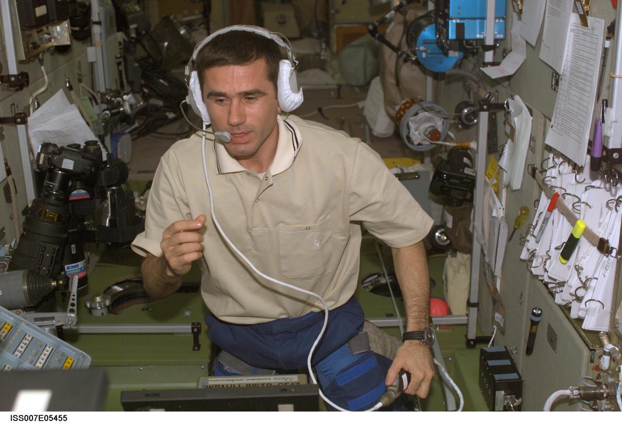 ISS007-E-05455 (15 May 2003) --- Cosmonaut Yuri I. Malenchenko, Expedition Seven mission commander, uses a communication system in the Zvezda Service Module on the International Space Station (ISS). Malenchenko represents Rosaviakosmos.