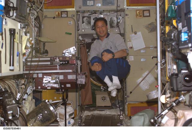 NASA image: Expedition Seven Science officer Lu tumbles in Zvezda module