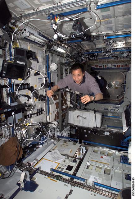 NASA image: Expedition Seven Science Officer Ed Lu flies throught the Destiny laboratory