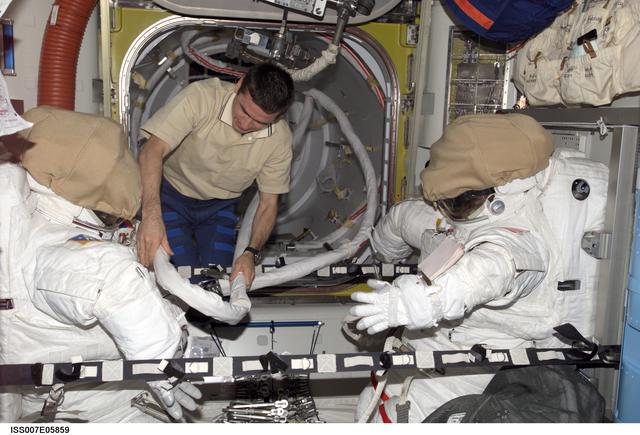 NASA image: Expedition Seven CDR Malenchenko in Quest airlock with EMUs