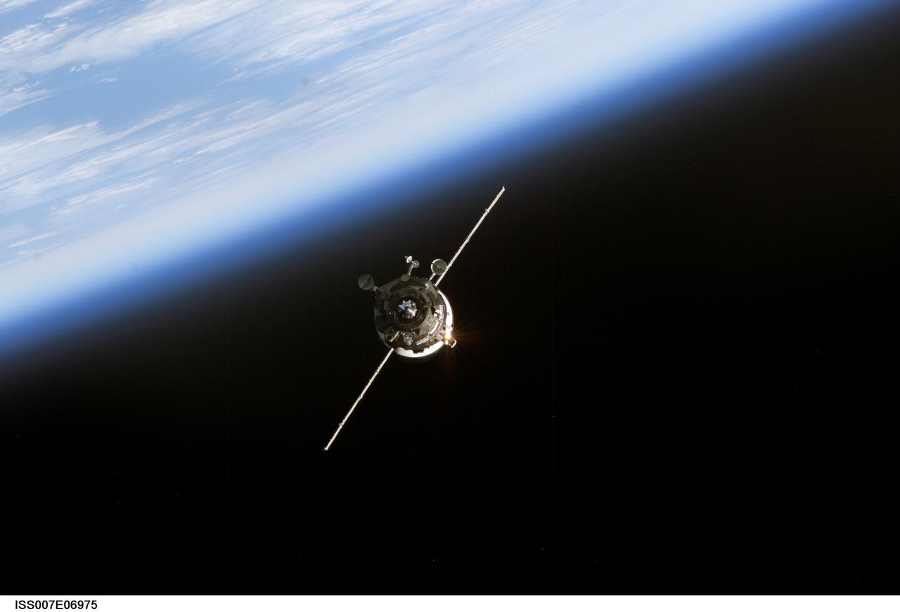 ISS007-E-06975 (11 June 2003) --- Backdropped by the blackness of space and Earth’s horizon, an unmanned Progress supply vehicle approaches the Pirs Docking Compartment (out of frame) attached to the Zvezda Service Module on the International Space Station (ISS), completing a three-day automated flight. The Progress 11 resupply craft, which launched from the Baikonur Cosmodrome in Kazakhstan on June 8, 2003, carried more than two tons of food, fuel, water, supplies and scientific gear for the Expedition 7 crew aboard the Station. The Progress linked up with the ISS at 6:15 a.m. (CDT) on June 11, 2003.