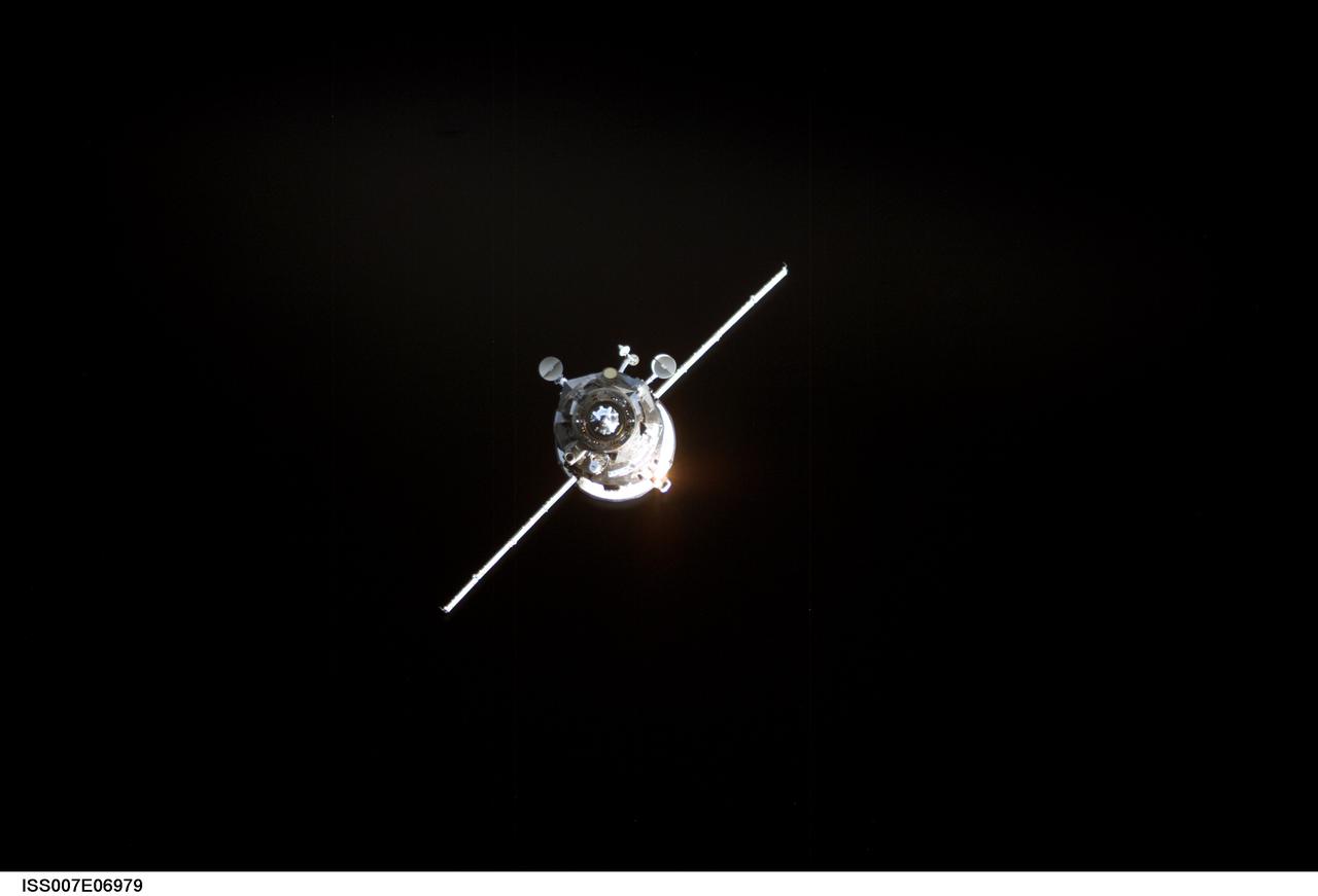 ISS007-E-06979 (11 June 2003) --- Backdropped by the blackness of space, an unmanned Progress supply vehicle approaches the Pirs Docking Compartment (out of frame) attached to the Zvezda Service Module on the International Space Station (ISS), completing a three-day automated flight. The Progress 11 resupply craft, which launched from the Baikonur Cosmodrome in Kazakhstan on June 8, 2003, carried more than two tons of food, fuel, water, supplies and scientific gear for the Expedition 7 crew aboard the Station. The Progress linked up with the ISS at 6:15 a.m. (CDT) on June 11, 2003.