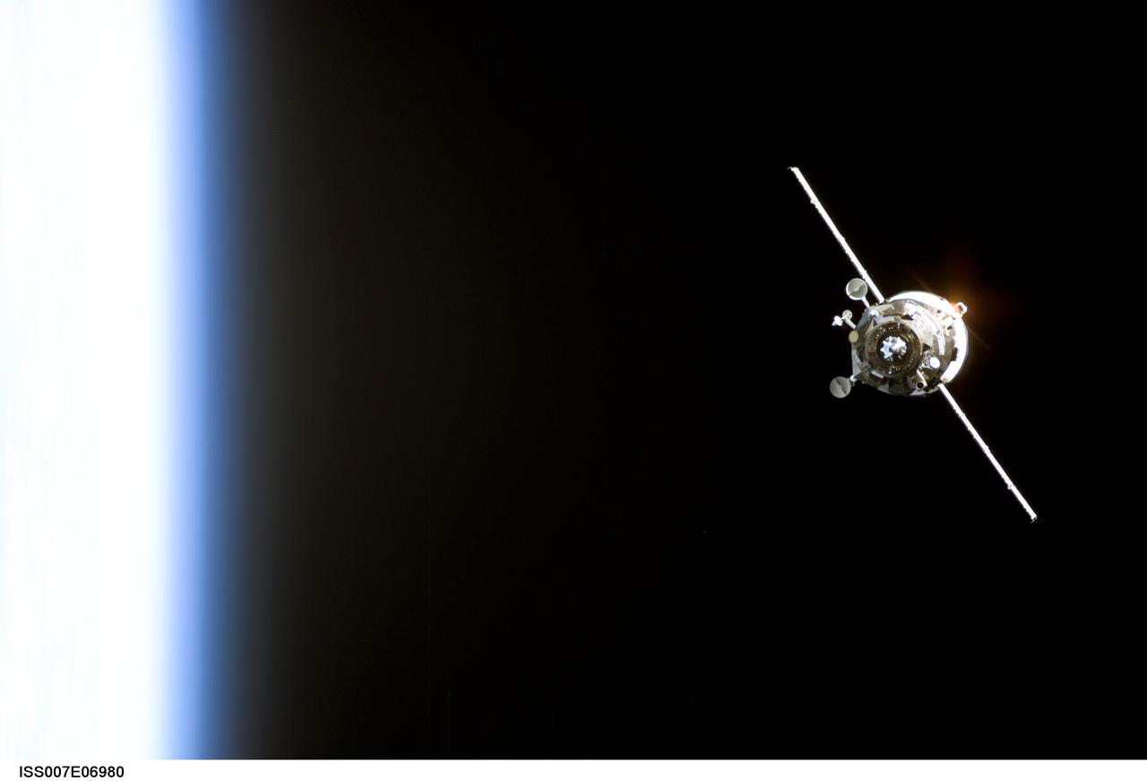 ISS007-E-06980 (11 June 2003) --- Backdropped by the blackness of space and Earth’s horizon, an unmanned Progress supply vehicle approaches the Pirs Docking Compartment (out of frame) attached to the Zvezda Service Module on the International Space Station (ISS), completing a three-day automated flight. The Progress 11 resupply craft, which launched from the Baikonur Cosmodrome in Kazakhstan on June 8, 2003, carried more than two tons of food, fuel, water, supplies and scientific gear for the Expedition 7 crew aboard the Station. The Progress linked up with the ISS at 6:15 a.m. (CDT) on June 11, 2003.