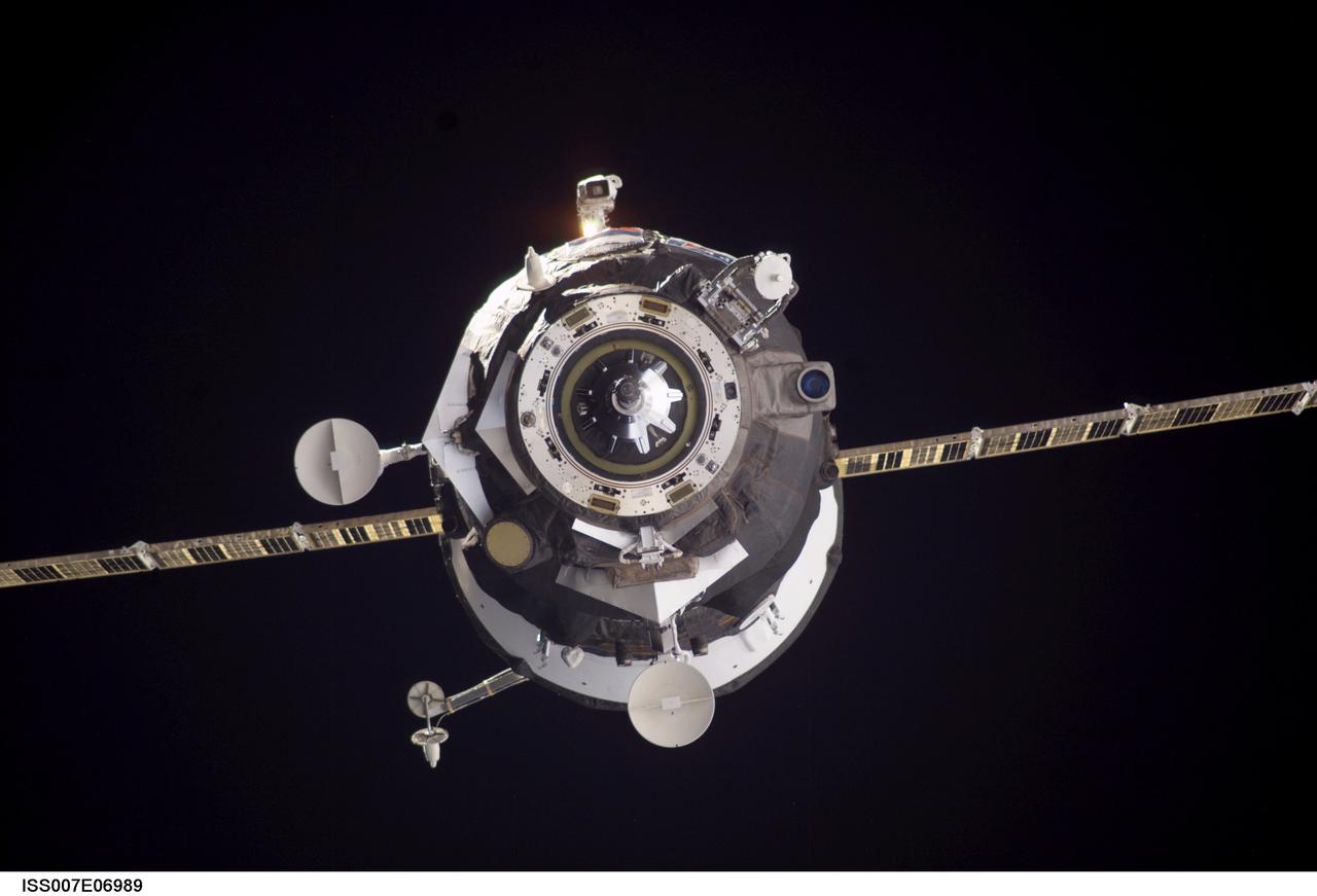 ISS007-E-06989 (11 June 2003) --- Backdropped by the blackness of space, an unmanned Progress supply vehicle approaches the Pirs Docking Compartment (out of frame) attached to the Zvezda Service Module on the International Space Station (ISS), completing a three-day automated flight. The Progress 11 resupply craft, which launched from the Baikonur Cosmodrome in Kazakhstan on June 8, 2003, carried more than two tons of food, fuel, water, supplies and scientific gear for the Expedition 7 crew aboard the Station. The Progress linked up with the ISS at 6:15 a.m. (CDT) on June 11, 2003.