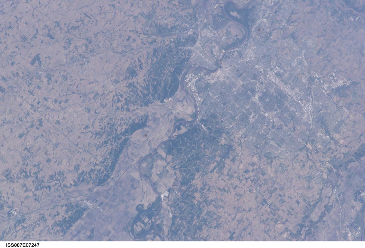 ISS007-E-07247 (13 June 2003) --- This image, photographed by an Expedition 7 crewmember onboard the International Space Station (ISS), features the Missouri River and a near-vertical view of Omaha, Nebraska. With a population estimated at more than three quarters of a million residents, Omaha is situated on high ground to the west of the river while Eppley Airfield and the town of Council Bluffs, Iowa are located on the floodplain.