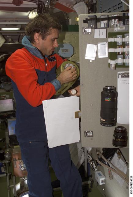 NASA image: Expedition Seven CDR Malenkenko performs IFM on Condensate Water Processor