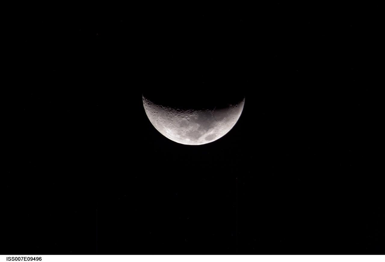ISS007-E-09496 (5 July 2003) --- A partial moon was photographed by an Expedition 7 crewmember onboard the International Space Station (ISS).