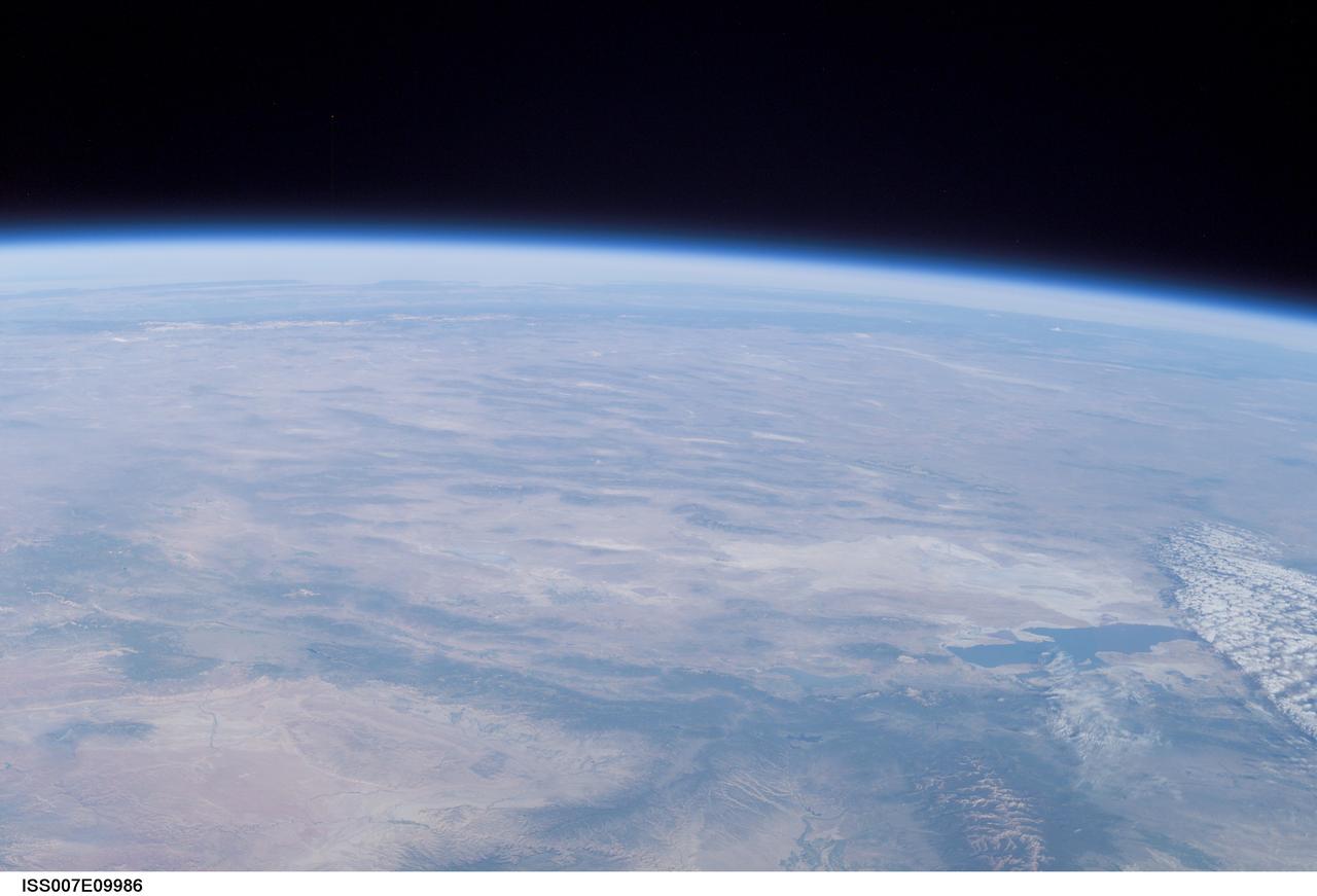 ISS007-E-09986 (11 July 2003) --- This view of Earth&#0146;s horizon was taken by an Expedition 7 crewmember onboard the International Space Station (ISS) while the Station was in orbit over Dodge City, Kansas. In the lower right is the Great Salt Lake. At the left side in the distance are the Sierra Nevada Mountains with elevations between 12,000 and 15,000 feet, and coastal California.