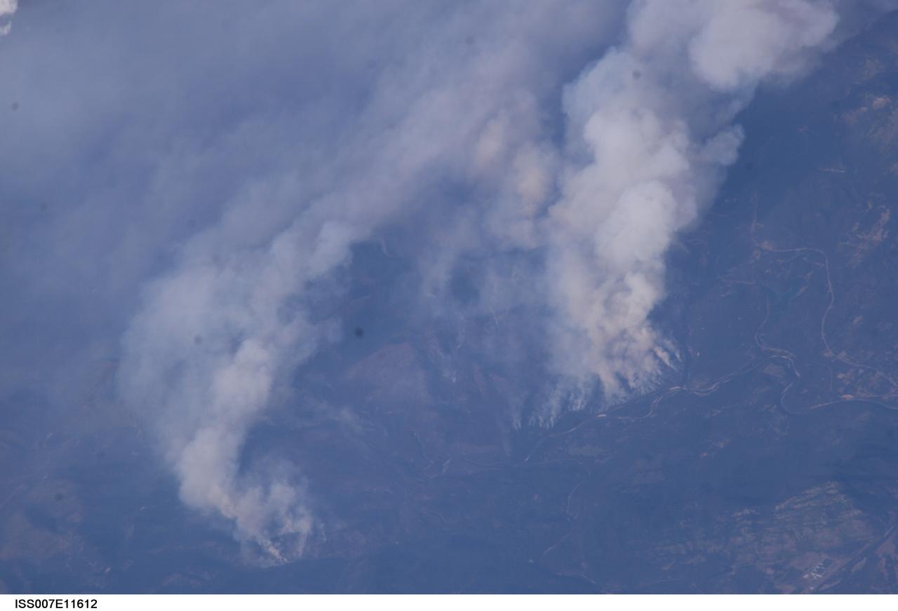 ISS007-E-11612 (2 August 2003) --- This digital still camera's view of  Glacier National Park in Montana, was captured by one of the crew members aboard the International Space Station orbiting earth at 215 nautical miles.  The area pictured is north of Flathead Lake on the southern flank of the Apgar Mountains, just across the Flathead River.