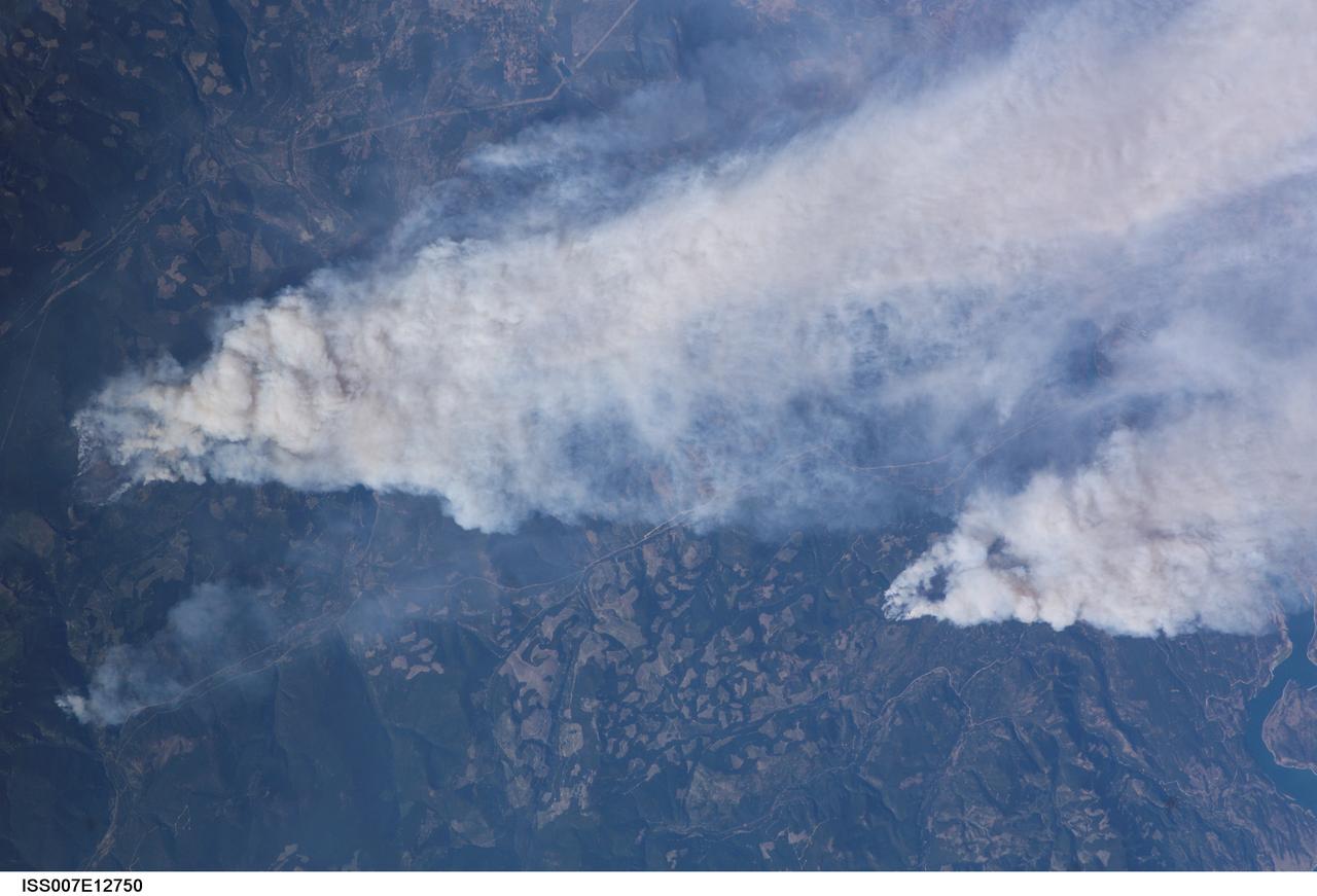 ISS007-E-12750 (14 August 2003) --- This view of forest fires in lower British Columbia, Canada was taken by one of the Expedition 7 crewmembers onboard the International Space Station (ISS).