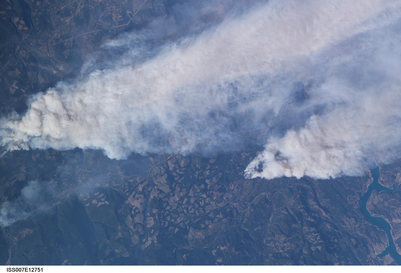 ISS007-E-12751 (14 August 2003) --- This view of forest fires in lower British Columbia, Canada was taken by one of the Expedition 7 crewmembers onboard the International Space Station (ISS).