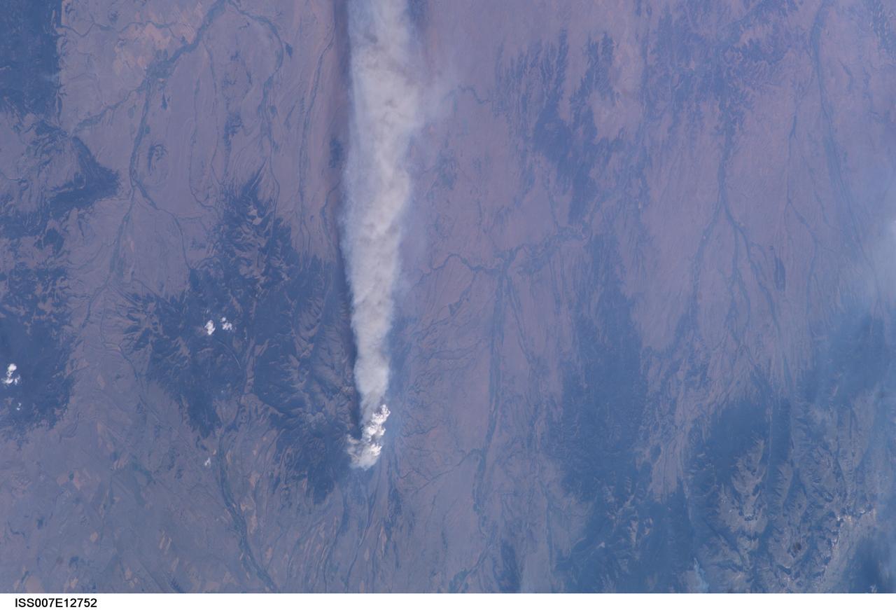 ISS007-E-12752 (14 August 2003) --- This view of forest fires in Glacier National Park in Montana was taken by one of the Expedition 7 crewmembers onboard the International Space Station (ISS).