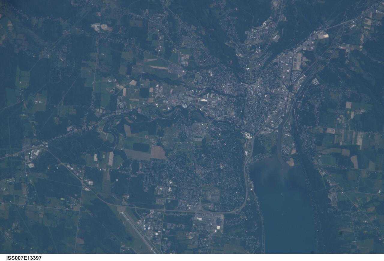 ISS007-E-13397 (24 August 2003) --- This view of Ithaca, New York was taken by one of the Expedition 7 crewmembers onboard the International Space Station (ISS). Ithaca is the home of Cornell University, where astronaut Edward T. Lu, NASA ISS science officer and flight engineer, received a Bachelor of Science degree in electrical engineering and the Cornell University Presidential Scholar award.