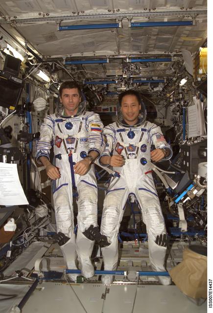NASA image: Expedition Seven Malenchenko and Lu wearing Sokol pressure suit in Destiny laboratory