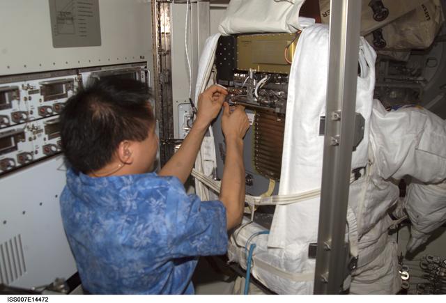 NASA image: Expedition Seven Lu with EMU in Quest airlock