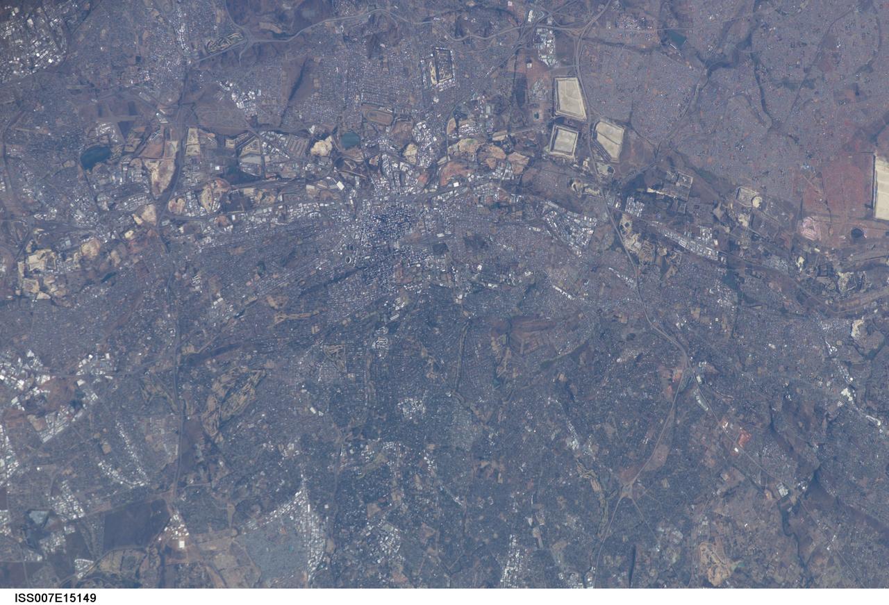 ISS007-E-15149 (21 September 2003) --- This image, photographed by an Expedition 7 crewmember onboard the International Space Station (ISS), was merged with images ISS007-E-15148 and ISS007-E-15150 to create a mosaic of Johannesburg, South Africa. The mosaic can be viewed on http://eol.jsc.nasa.gov