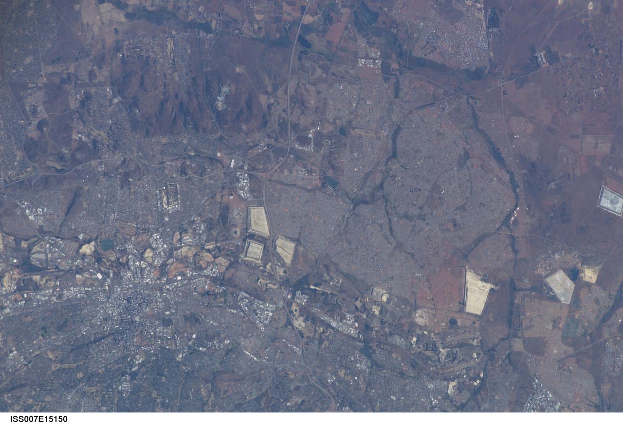 ISS007-E-15150 (21 September 2003) --- This image, photographed by an Expedition 7 crewmember onboard the International Space Station (ISS), was merged with images ISS007-E-15148 and ISS007-E-15149 to create a mosaic of Johannesburg, South Africa. The mosaic can be viewed on http://eol.jsc.nasa.gov