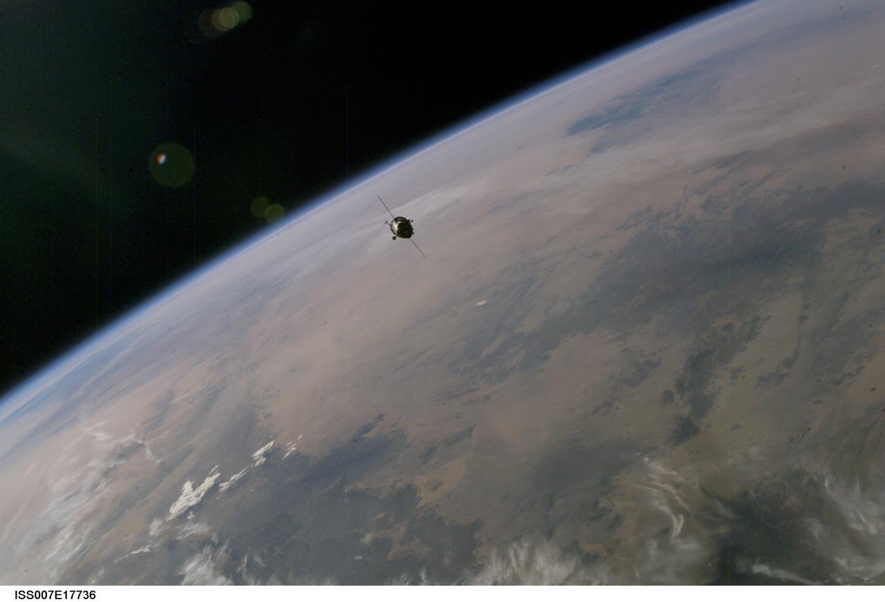 ISS007-E-17736 (20 October 2003) --- This picture of a distant Soyuz TMA-3 spacecraft was recorded by one of the Expedition 7 crewmembers aboard the International Space Station (ISS). Two days after launching from Kazakhstan, the Soyuz, carrying the two Expedition 8 crewmembers,  astronaut C. Michael Foale, American commander and NASA ISS science officer,  and Russian cosmonaut Alexander Kaleri,  flight engineer and Soyuz commander,  along with European Space Agency astronaut Pedro Duque, docked with the Station at 2:16 a.m. CDT (0716 GMT) October 20. At the time of the actual docking, both spacecraft were orbiting Earth above Russia.