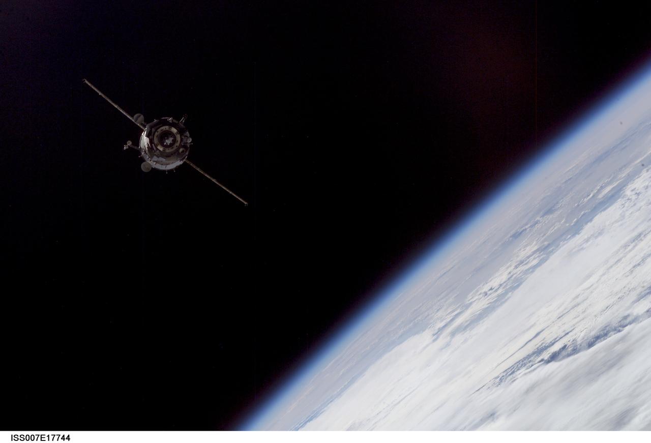 ISS007-E-17744 (20 October 2003) --- This picture of a distant Soyuz TMA-3 spacecraft was recorded by one of the Expedition 7 crewmembers aboard the International Space Station (ISS). Two days after launching from Kazakhstan, the Soyuz, carrying the two Expedition 8 crewmembers,  astronaut C. Michael Foale, American commander and NASA ISS science officer,  and Russian cosmonaut Alexander Kaleri,  flight engineer and Soyuz commander,  along with European Space Agency astronaut Pedro Duque, docked with the Station at 2:16 a.m. CDT (0716 GMT) October 20. At the time of the actual docking, both spacecraft were orbiting Earth above Russia.