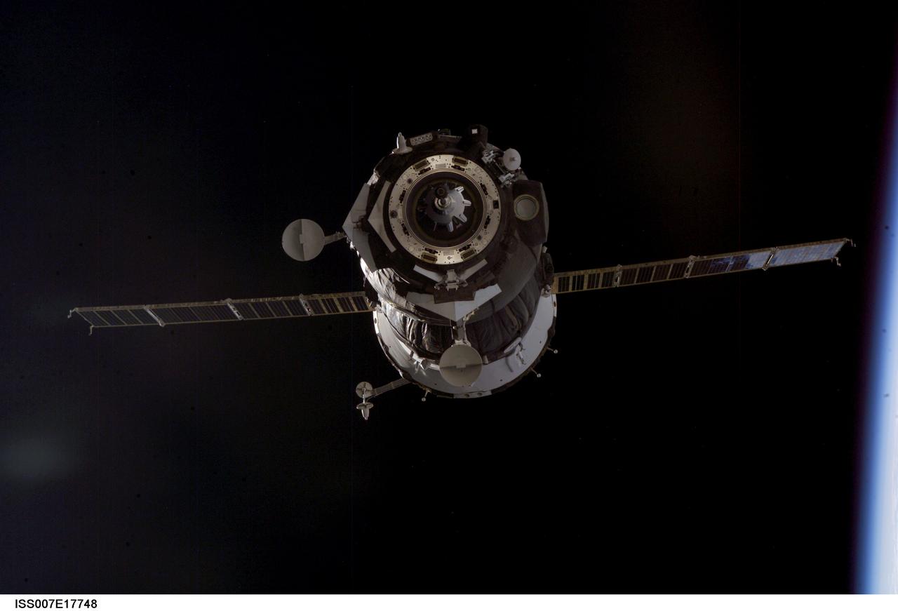 ISS007-E-17748 (20 October 2003) --- Two days after launching from Kazakhstan, the Soyuz TMA-3 spacecraft, carrying the two Expedition 8 crewmembers, astronaut C. Michael Foale,  American commander and NASA ISS science officer; and Russian cosmonaut Alexander Kaleri, flight engineer and Soyuz commander, along with European Space Agency astronaut Pedro Duque, docked with the International Space Station at 2:16 a.m. CDT (0716 GMT) October 20. At the time of the actual docking, both spacecraft were orbiting Earth above Russia.