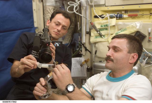 NASA image: Duque and Kaleri in Zvezda Service module with video camera